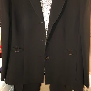 Women’s black pant suite.